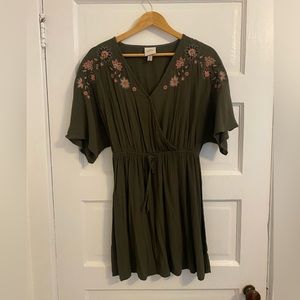 Olive green dress with embroidered flowers.